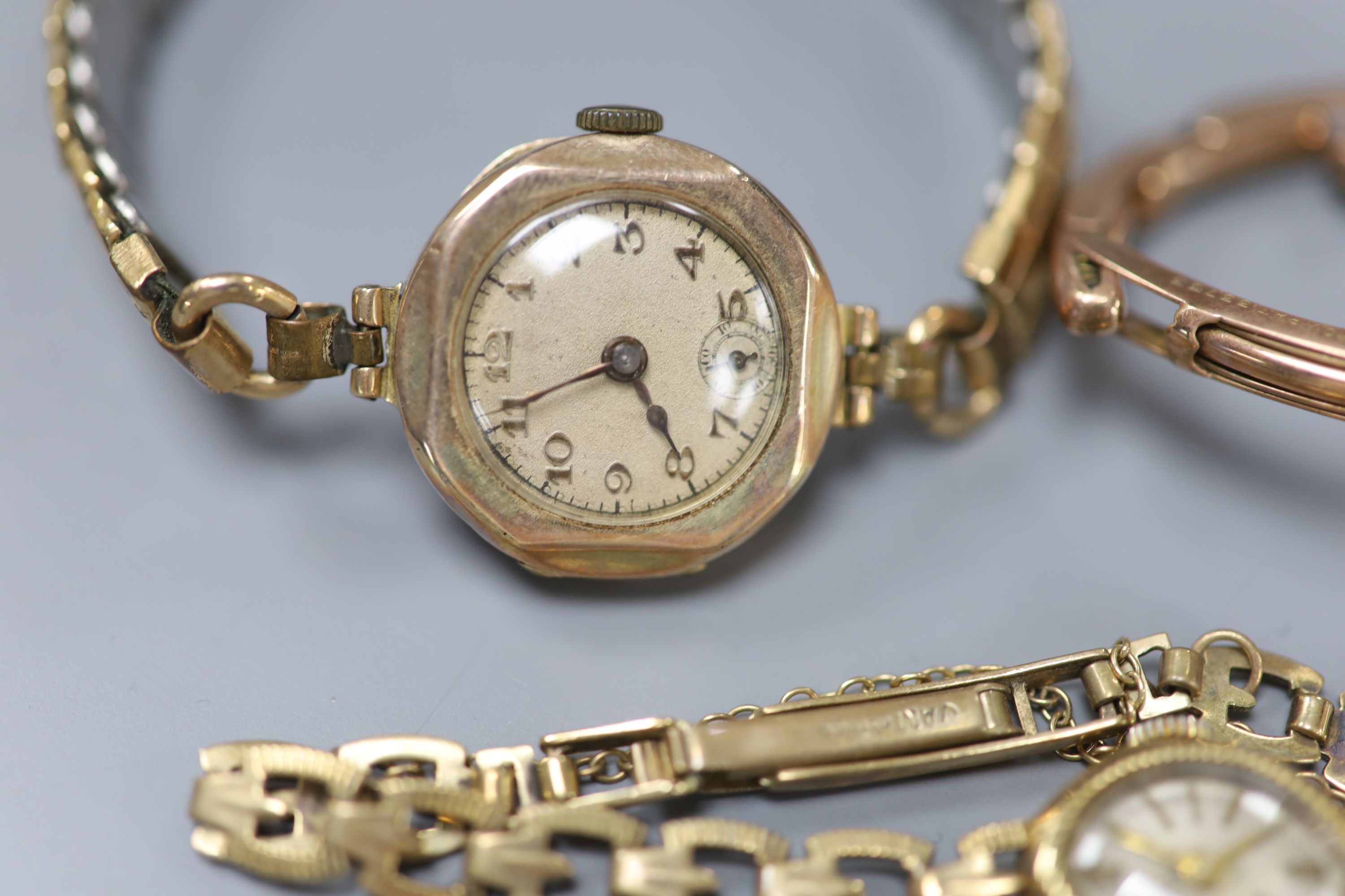 Three 9ct gold-cased ladys wristwatches, one with 9ct gold marked bracelet (latter gross 11.5 grams).